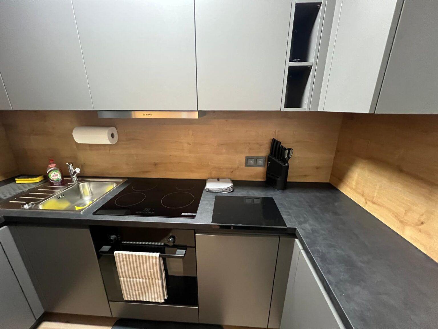 Kitchen with hob, oven and sink